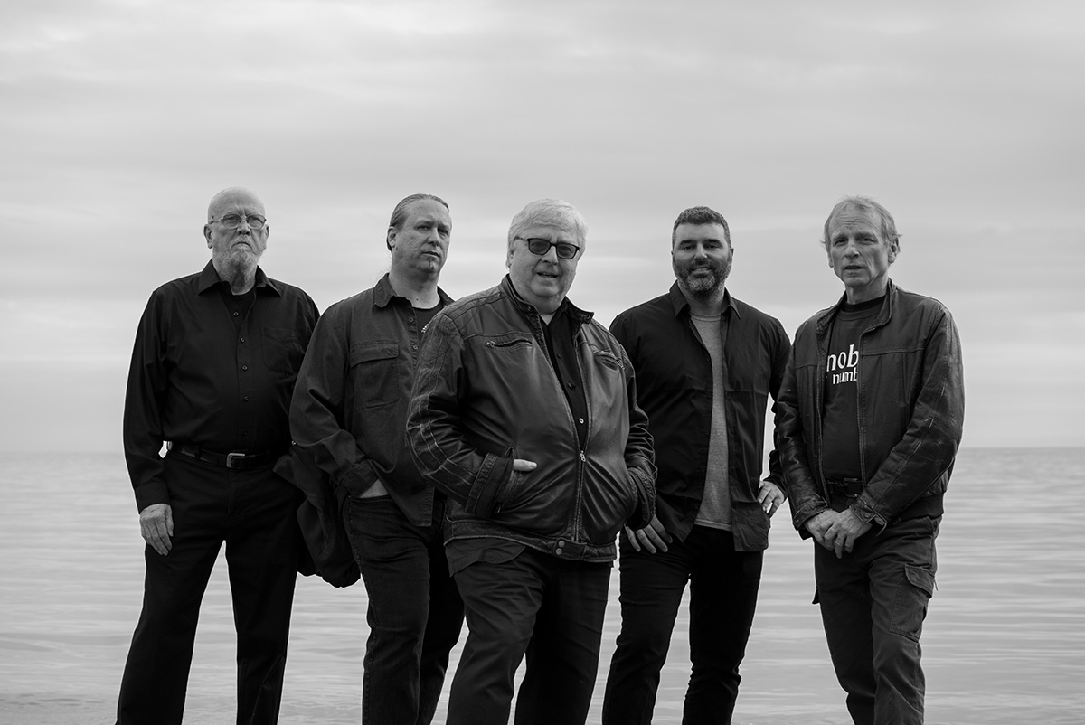 The current members of the CEE standing beside a lake - (L to R) Jim Montgomery, Paul Stillwell, David Jaeger, John Kameel Farah, David Sutherland